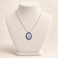 COLAR COM CRUZ DE ZIRCÔNIA AZUL SAFIRA BANHO PRATA