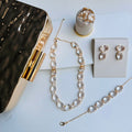 Kit Clutch, Anel, Brinco, Pulseira e Colar Oval em Zirconia Fúcsia Doria