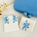 Kit Clutch, Brinco e Anel Regulável Alê Azul Fosco Prata