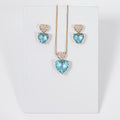 kit Colar e Brinco Coração de Zircônia Azul Claro com Cristal Bia Banho de Ouro 18k