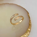 Anel Espiral Dourado Com Zircônia