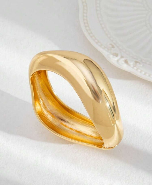 Bracelete Ondas Dourado Aço Inox